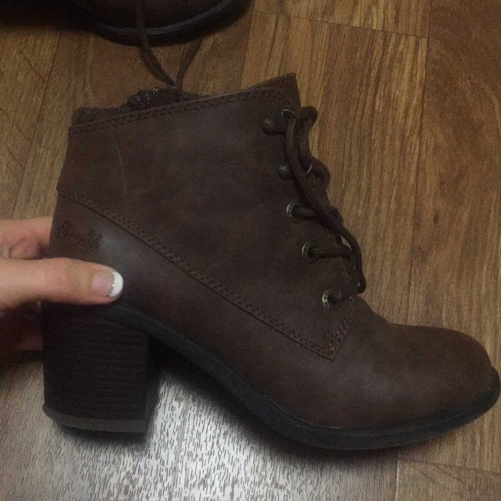 Brown lace up boots.